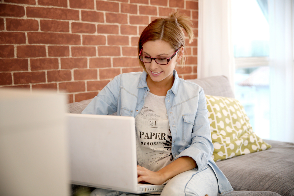 Young woman using laptop computer at home